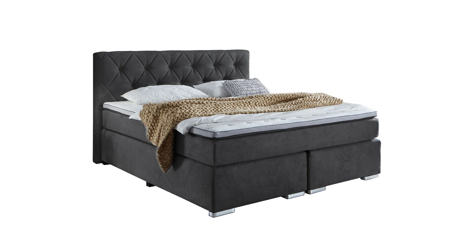 Das Retro-Boxspringbett "Bryce" mit grauem Webstoffbezug und markantem Kopfteil.