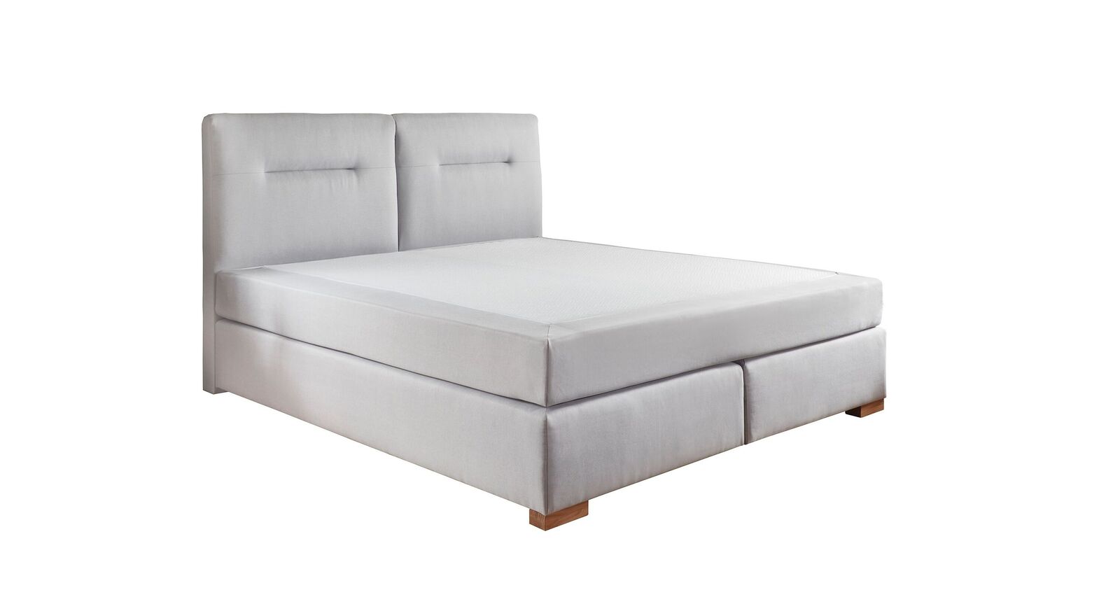 Ab der Doppelbett-Größe ist das Kopfteil des Boxspringbettes "Carlita" geteilt.