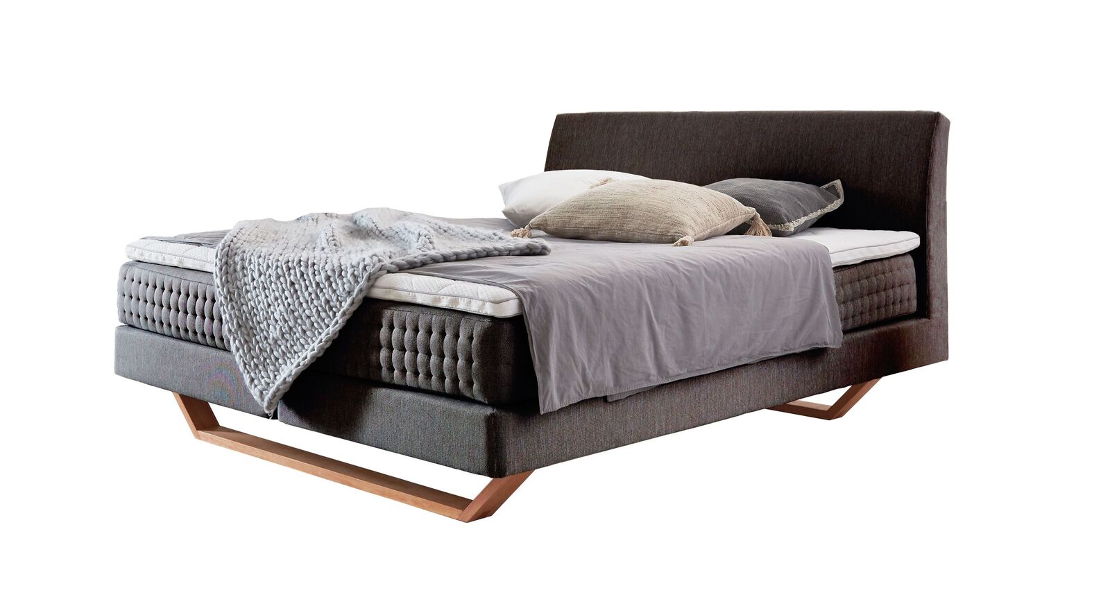 Das Boxspringbett "Clarice" im modernen Material-Mix - hier mit anthrazitfarbenem Webstoffbezug.