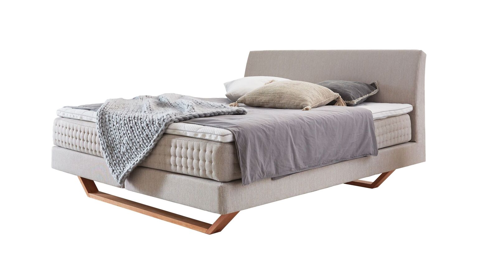Das Boxspringbett "Clarice" im modernen Material-Mix - hier mit cremefarbenem Webstoffbezug.