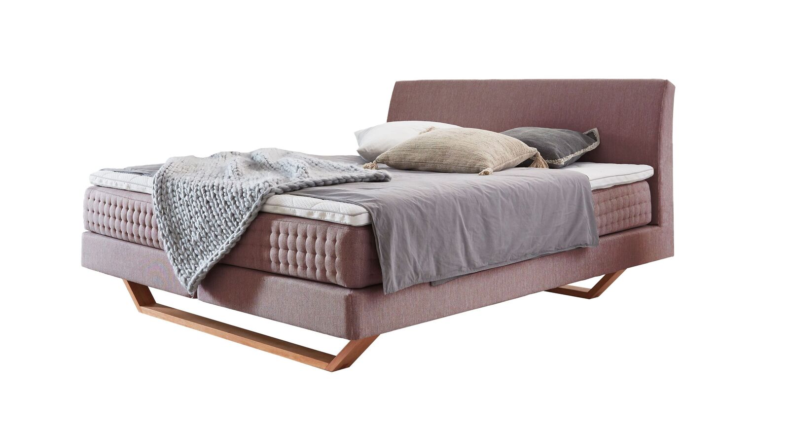 Das Boxspringbett "Clarice" im modernen Material-Mix - hier mit rosafarbenem Webstoffbezug.