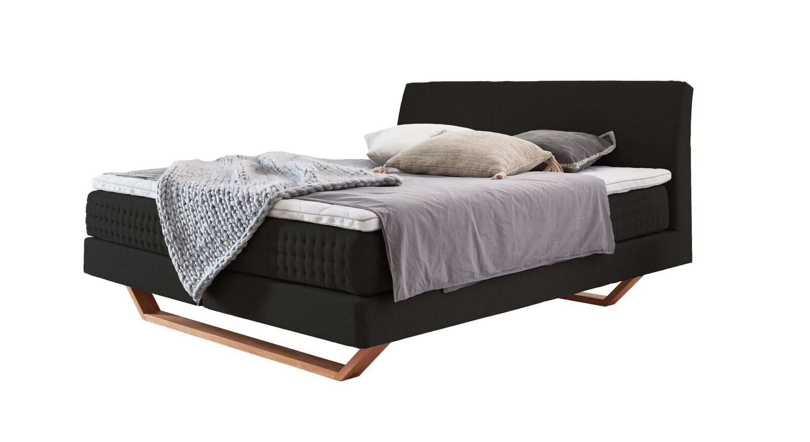 Das Boxspringbett "Clarice" im modernen Material-Mix - hier mit schwarzem Webstoffbezug.