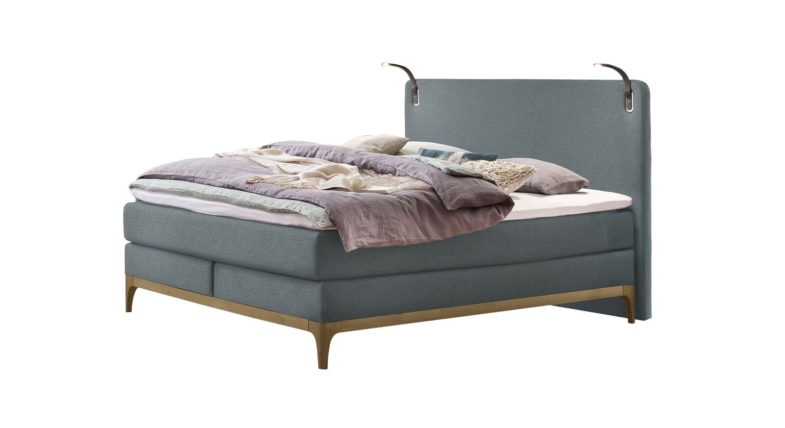 Mit dem blaugrauen Stoffbezug wirkt das Boxspringbett "Danilo" besonders frisch und modern.