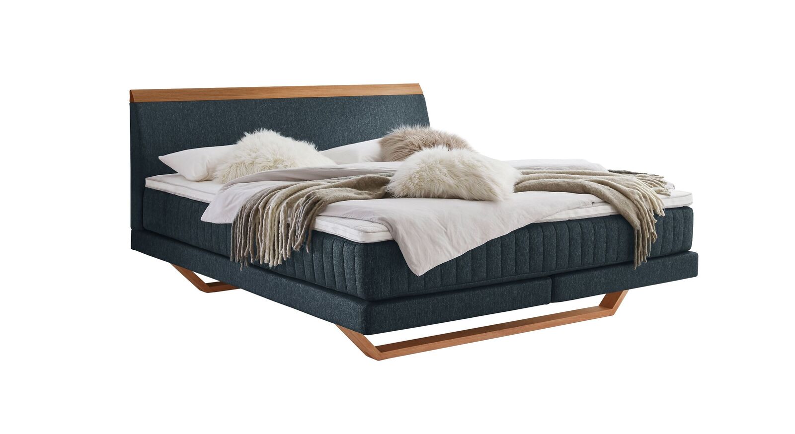 Das moderne Boxspringbett "Imandra" - hier mit petrolfarbenem Webstoffbezug.