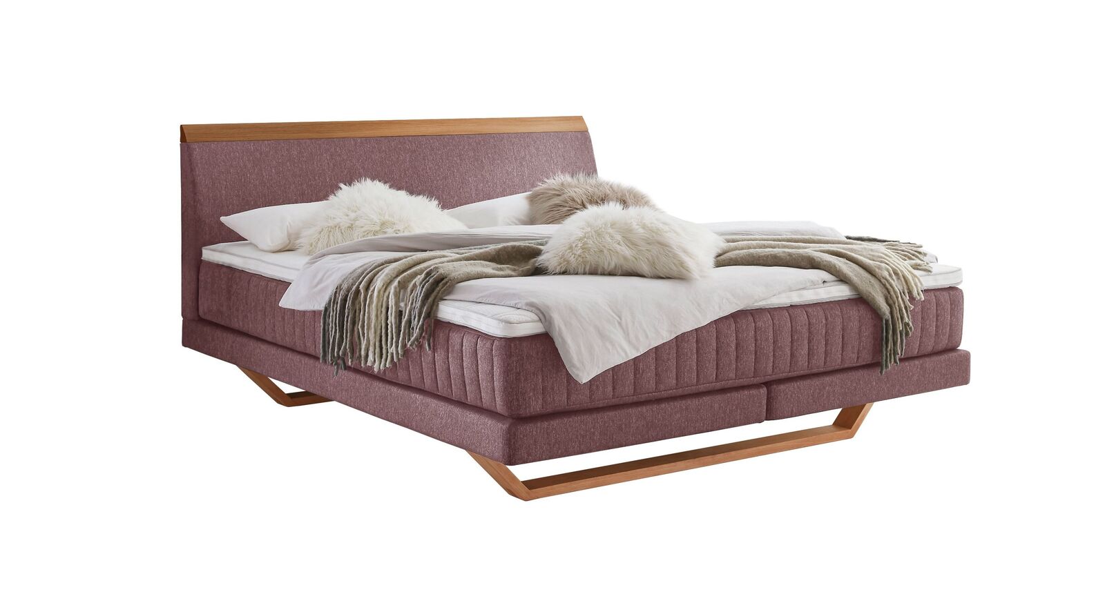 Das moderne Boxspringbett "Imandra" - hier mit rosafarbenem Webstoffbezug.