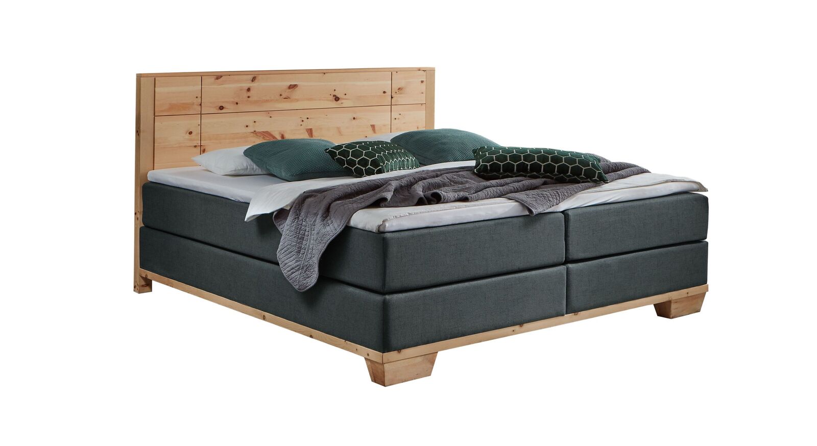 Das markante Boxspringbett "Sinestra" im modernen Materialmix – hier mit anthrazitfarbenem Stoffbezug.