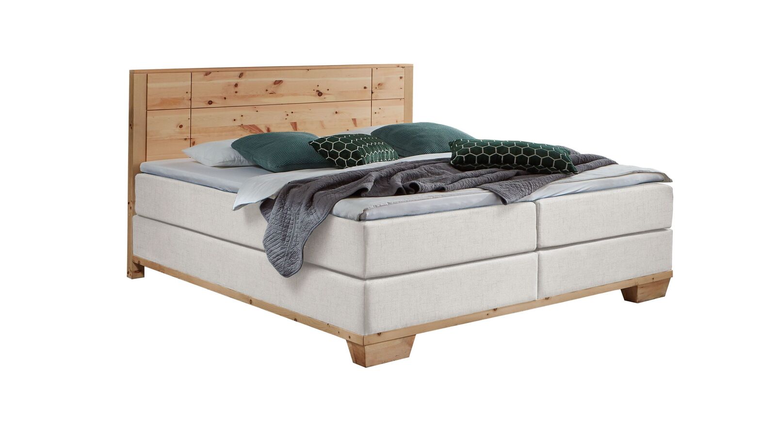Das markante Boxspringbett "Sinestra" im modernen Materialmix – hier mit Stoffbezug in Offwhite.