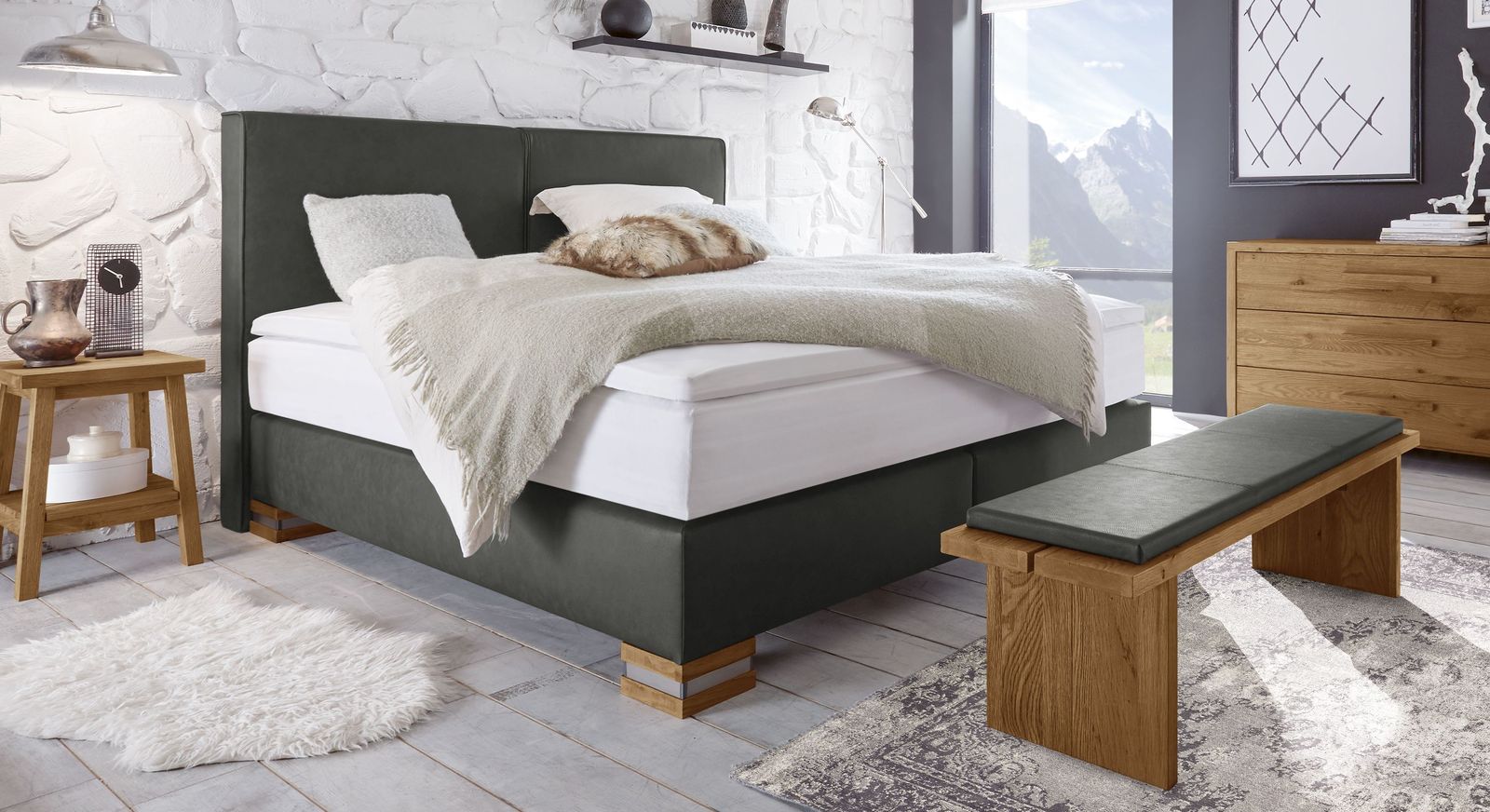 Das Boxspringbett "Tholen" (hier in Anthrazit und Wildeiche natur) bietet luxuriösen Schlafkomfort.