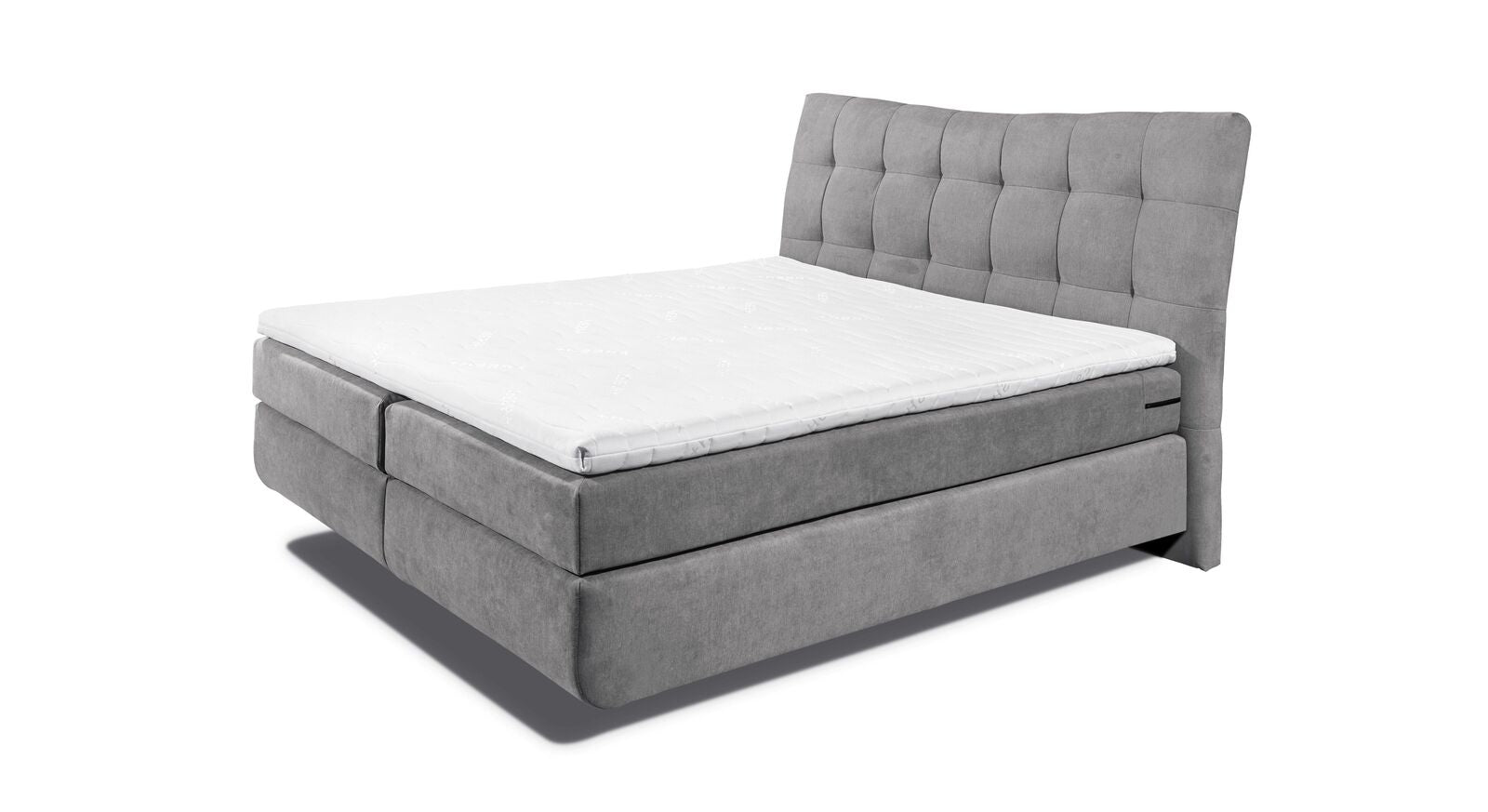 Das Boxspringbett "Tobin" wird inklusive Tonnentaschenfederkern-Matratzen und einem Topper aus Komfortschaum geliefert.