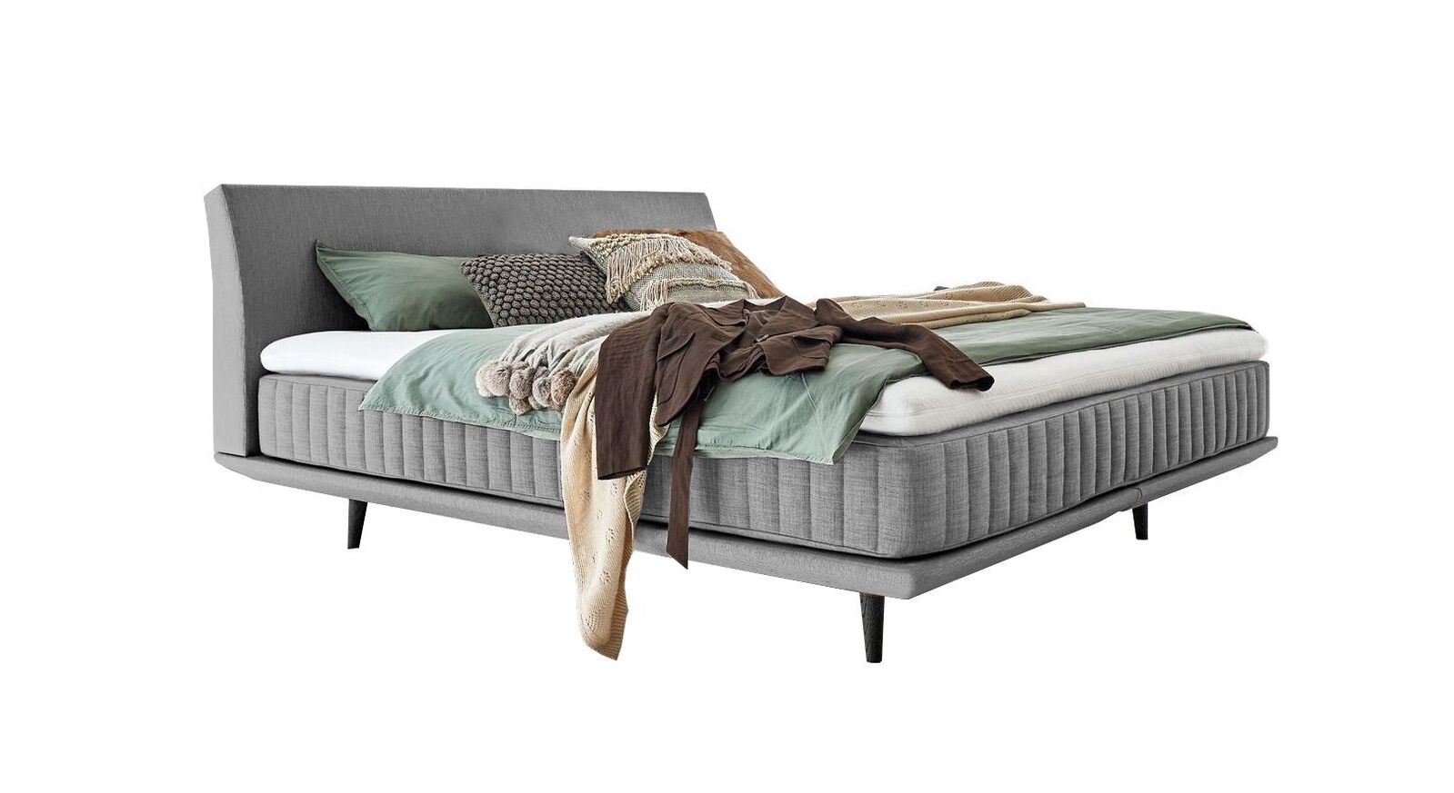 Das elegante Boxspringbett "Valtor" – hier mit einem Webstoffbezug in Hellgrau.