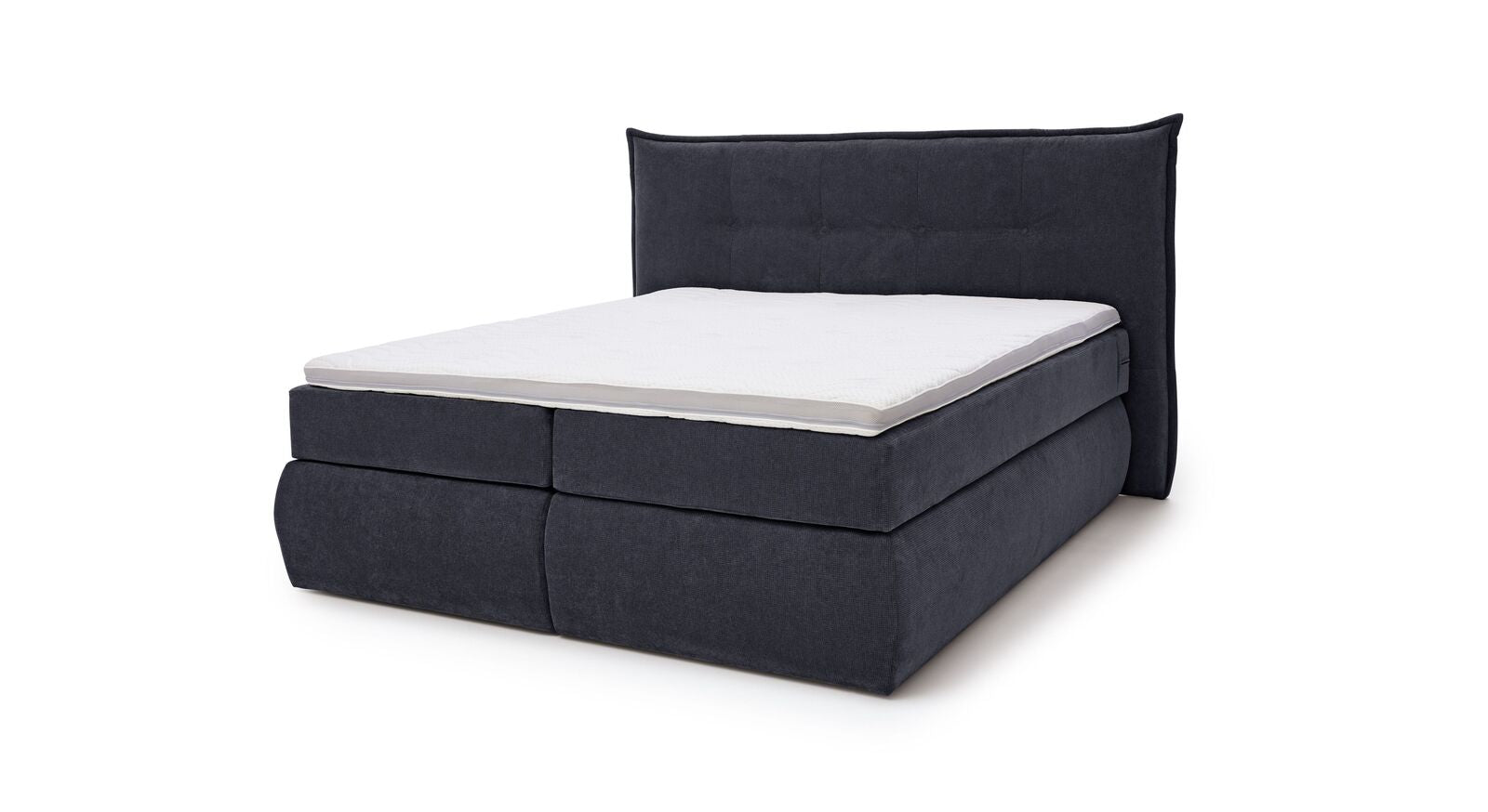 Das MUSTERRING Bettkasten-Boxspringbett "Felina-Case" Fledermaus – hier mit grobem Microfaserbezug in Dunkelblau.