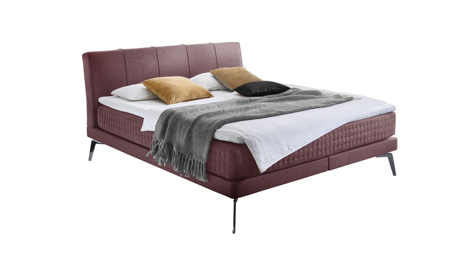 Das Boxspringbett "Elipsa" &ndash; hier mit Stoffbezug in Rosa.
