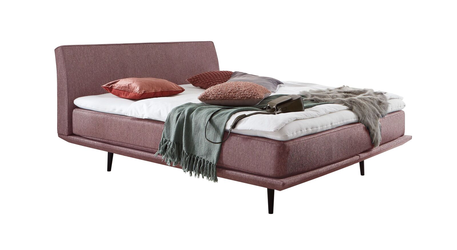 Das moderne Boxspringbett "Erendor" &ndash; hier mit einem Webstoffbezug in Rosa.