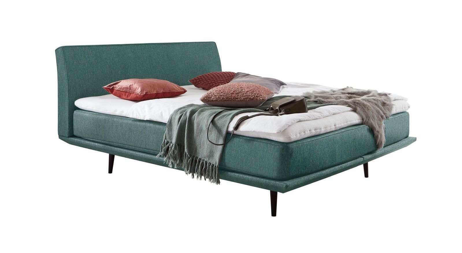 Das moderne Boxspringbett "Erendor" &ndash; hier mit einem Webstoffbezug in T&uuml;rkis.
