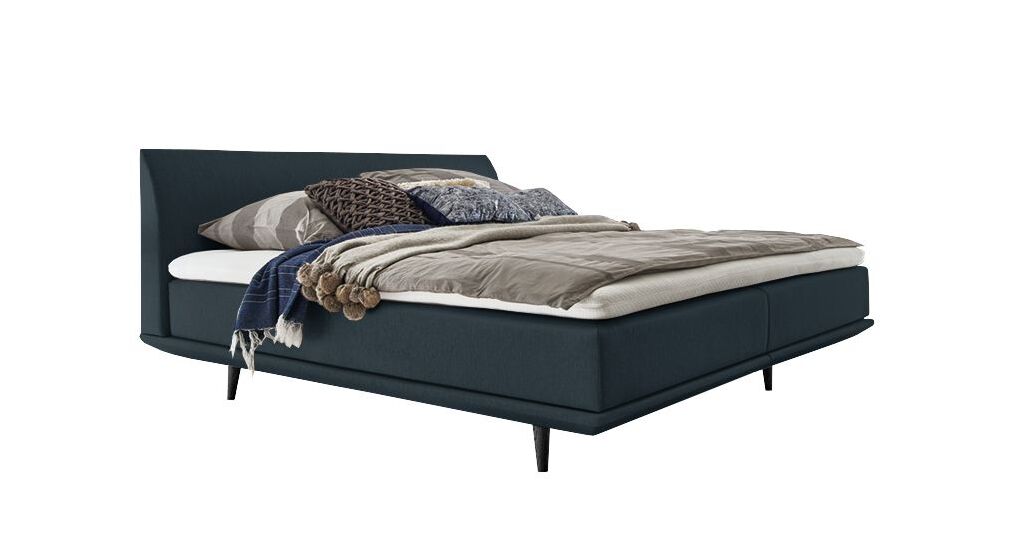 Das geradlinige Boxspringbett "Lajana" im Skandi Look &ndash; hier mit einem Webstoffbezug in Petrol.
