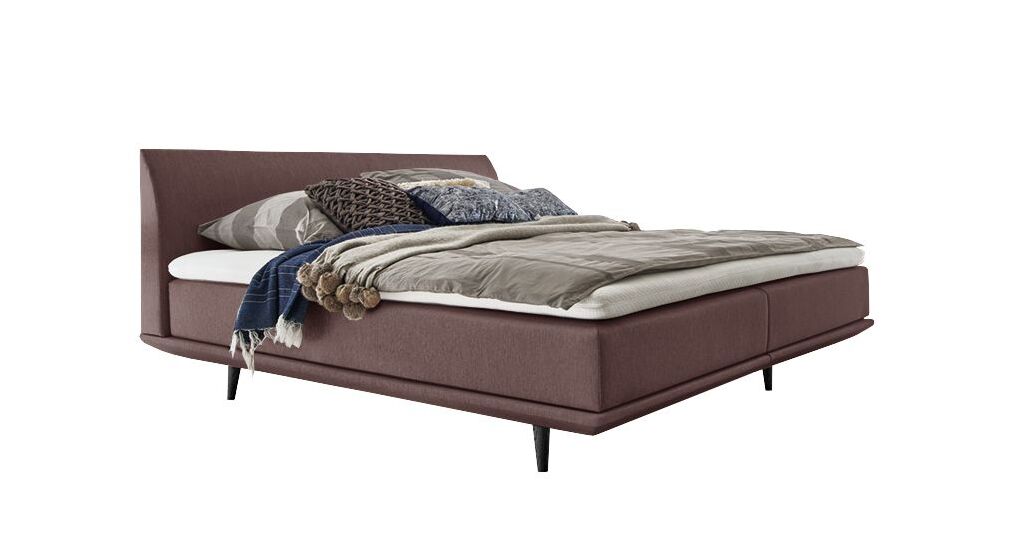 Das geradlinige Boxspringbett "Lajana" im Skandi Look &ndash; hier mit einem Webstoffbezug in Rosa.
