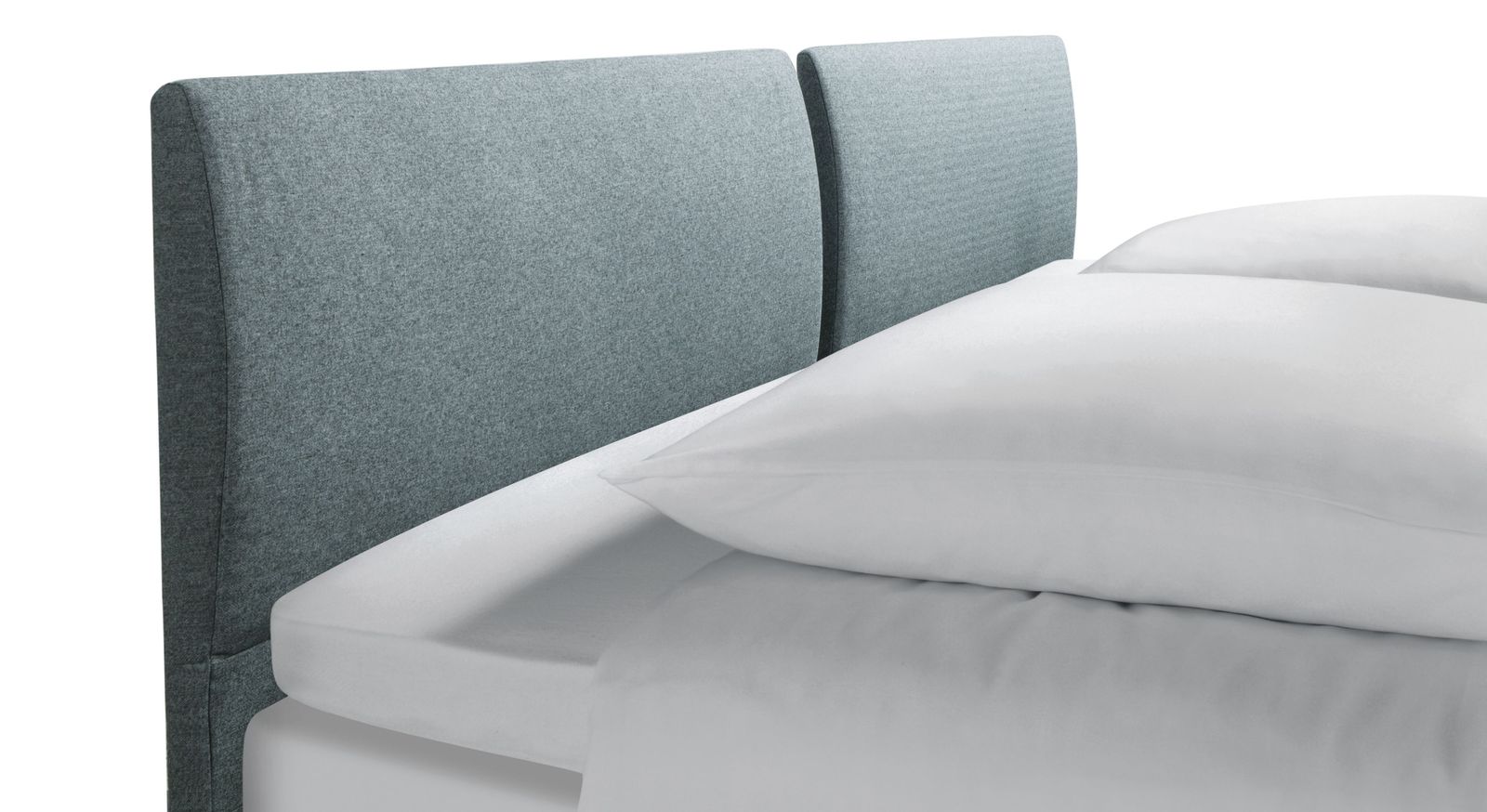 Das zweigeteilte Kopfteil des Boxspringbettes "Viane" begeistert mit einer sanften ergonomischen W&ouml;lbung.