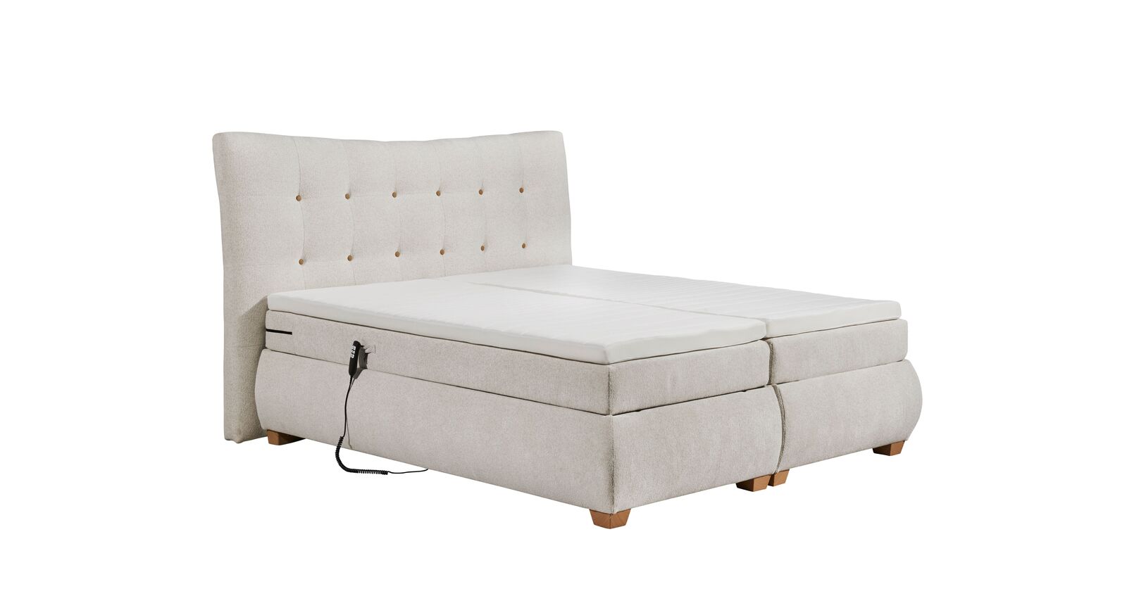Das cremefarbene Boxspringbett "Randy" mit elektrischer Verstellung und hochwertiger Bettausstattung.
